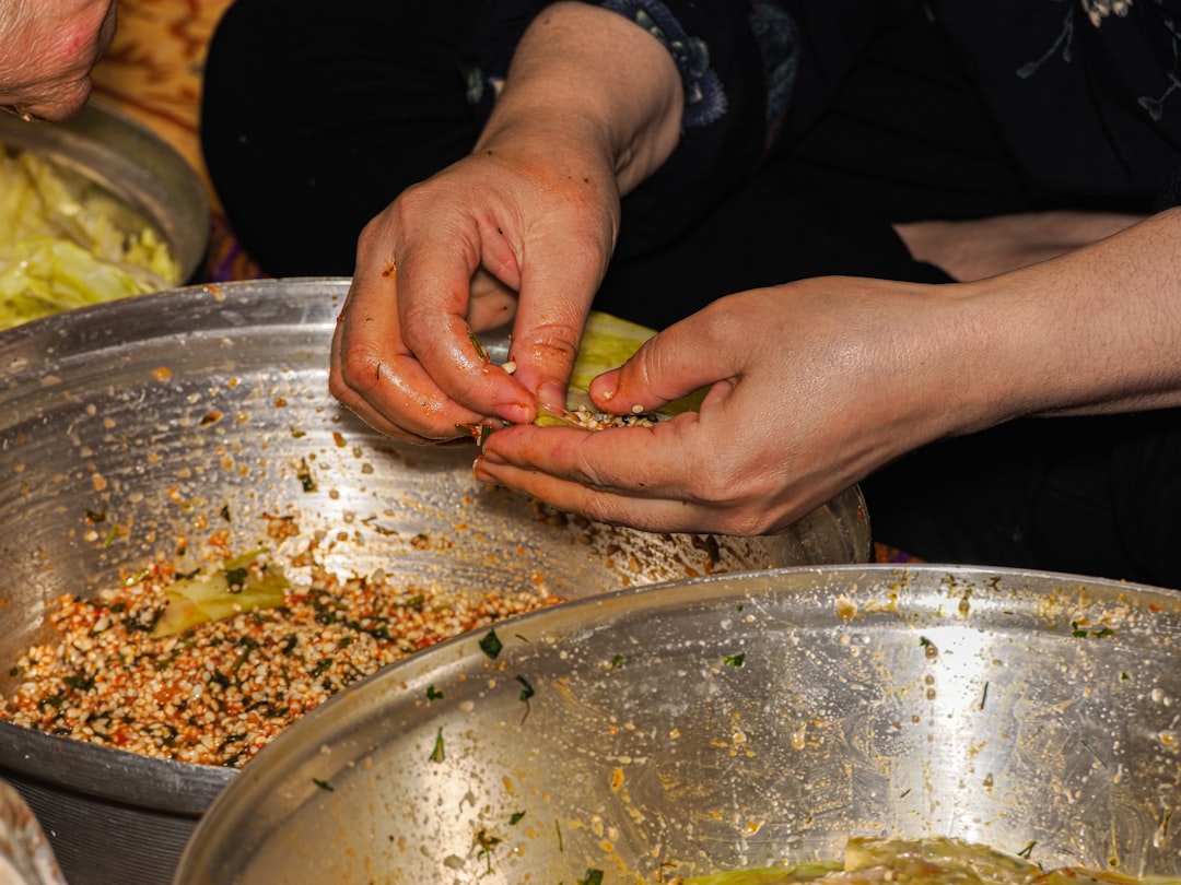 TCM physician hands preparing traditional herbal medicine