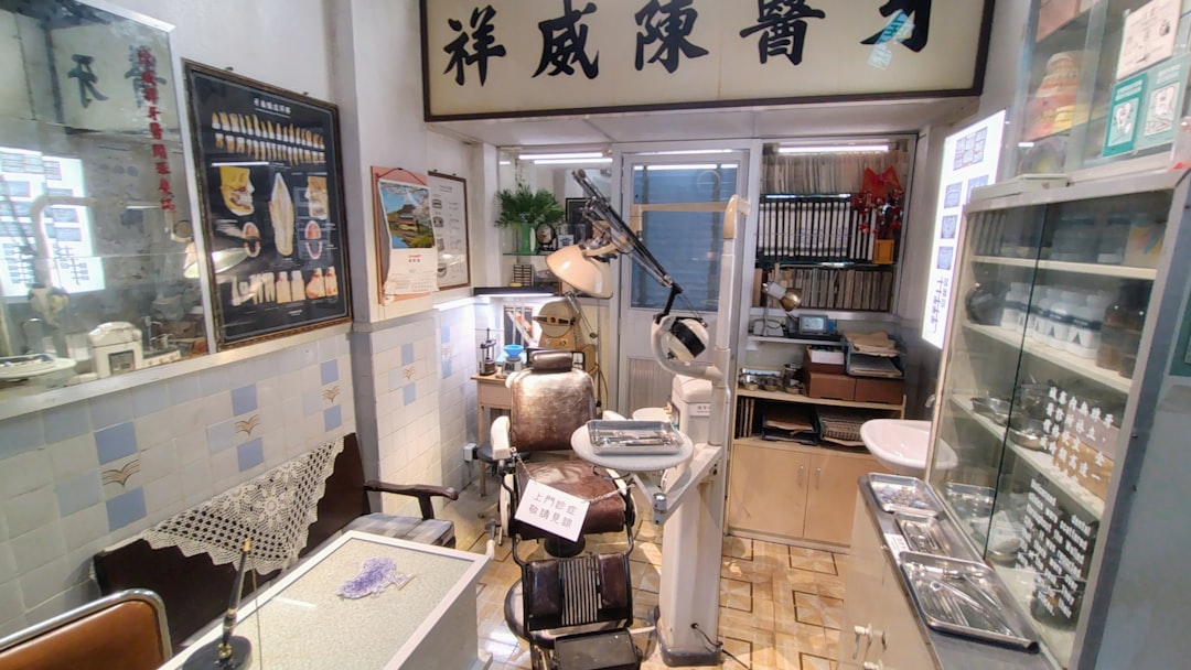 Serene TCM treatment room with sage green linens and terracotta accents in Ang Mo Kio clinic