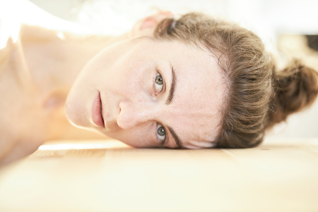 Patient experiencing deep relaxation during gentle acupuncture treatment